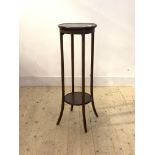 An Edwardian mahogany jardiniere stand, the circular top raised on square splayed supports united by