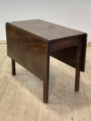 A George III mahogany drop leaf table, raised on square moulded and chamfered supports, H70cm L91cm,