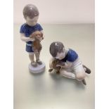 A Bing and Grondahl Danish figure of a boy holding a puppy and a Royal Copenhagen Danish porcelain