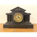 A Victorian slate architechtural mantel clock, the gilt dial with Arabic chapter ring, flanked by