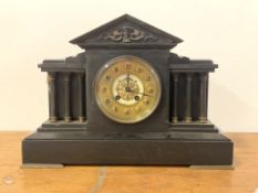 A Victorian slate architechtural mantel clock, the gilt dial with Arabic chapter ring, flanked by