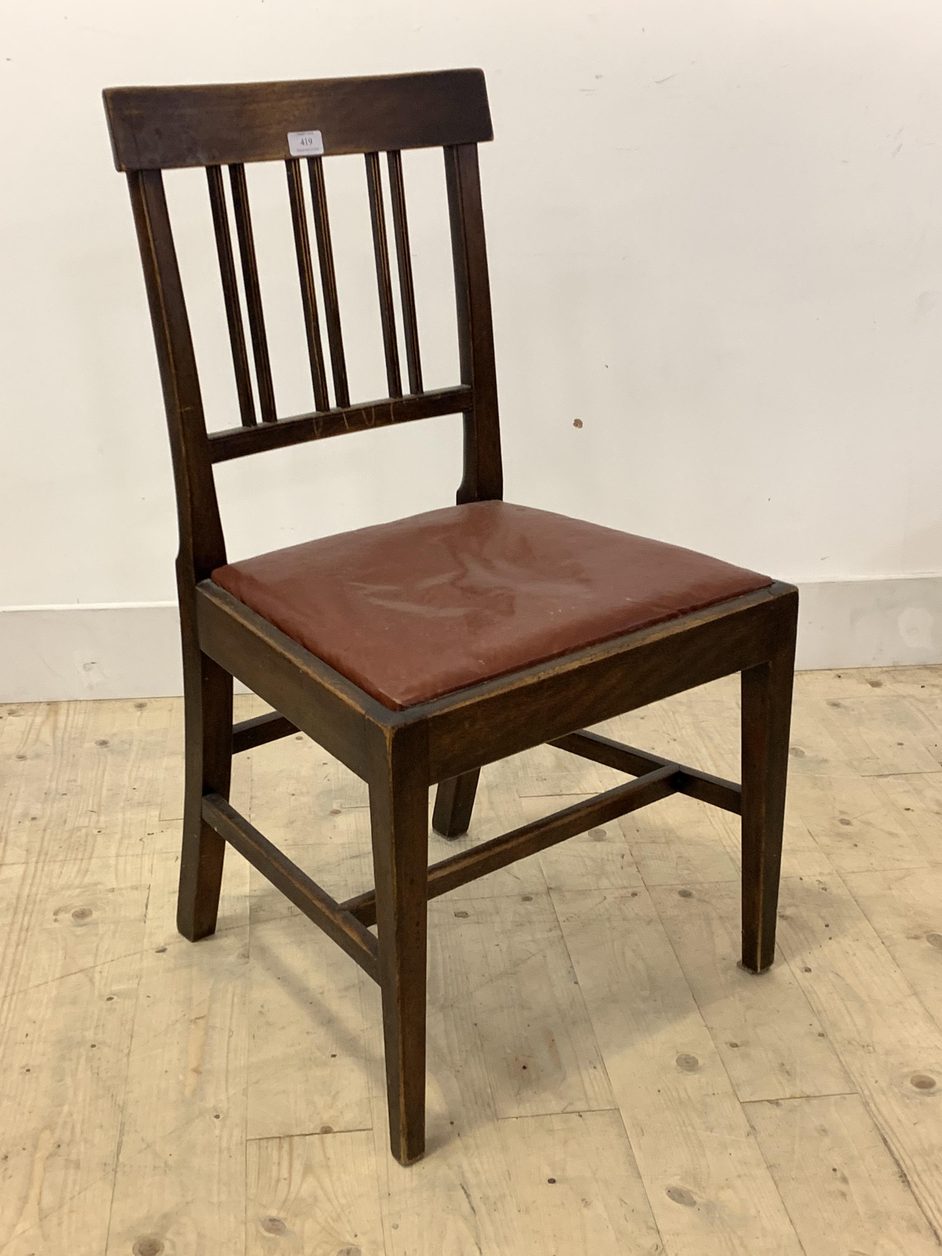 A 19th century mahogany dining chair with spar back, drop in seat pad, raised on square tapered