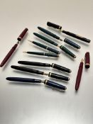 A collection of Parker fountain pens and propelling pencils including two maroon coloured Parker