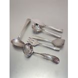 A four-piece continental white metal set including butter knife, sugar sifter, cake lift and fork,