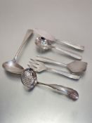 A four-piece continental white metal set including butter knife, sugar sifter, cake lift and fork,
