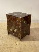 A Chinese bed side cupboard, red lacquered and with gilt chinoiserie decoration, fitted with a