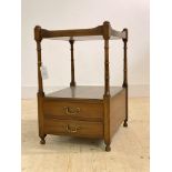 A Georgian style mahogany two tier lamp table, early 20th century, the tray top over ring turned