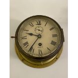 A Smiths Astral brass ships bulk head type clock, cream painted dial with Roman chapter ring and