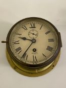 A Smiths Astral brass ships bulk head type clock, cream painted dial with Roman chapter ring and