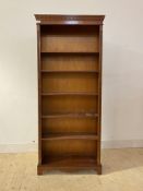 A Georgian style mahogany floor standing open bookcase fitted with five adjustable shelves,