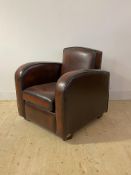 A Quality Art Deco style club chair, upholstered in oxblood red leather, with squab cushion,