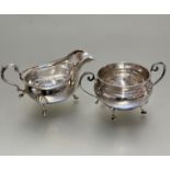 A Birmingham silver George III style, gardroon rimmed bordered, sauce boat in shell cast pad feet,