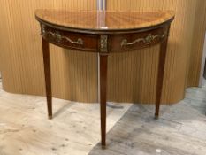 A Continental gilt-metal mounted kingwood demilune fold over card table, the rosewood crossbanded