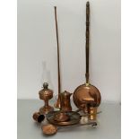 A collection of Edwardian and later copperware including a coaching horn, a bed warming pan, oil