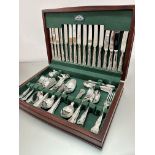 An Epns John Turton of Sheffield suite of double struck patterned flatware including table knives,