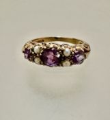 A 9ct gold Edwardian style three-stone amethyst and cluster ring, set four seed pearls, mounted in