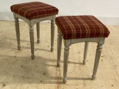 A pair of grey painted French style stools, with tartan wool upholstered seats, raised on turned and