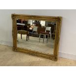 A large gilt composition framed wall hanging mirror, 123cm x 98cm