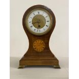 An Edwardian inlaid mahogany balloon mantel time piece clock, the white enamel dial with Roman