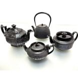 A Japanese style cast iron tapered black enamelled teapot (h 19cm including handle x d 12cm), a