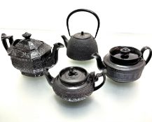 A Japanese style cast iron tapered black enamelled teapot (h 19cm including handle x d 12cm), a