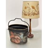 An Edwardian cast iron oval coal pail with loop handle to top with decoupage floral decoration (