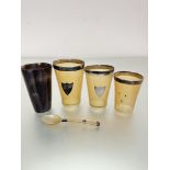 A set of three graduated horn beakers with Birmingham silver mounts and shields, one missing shield,