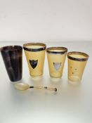 A set of three graduated horn beakers with Birmingham silver mounts and shields, one missing shield,