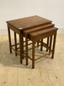 A stained birch and cross banded rosewood nest of three tables, first half of the 20th century