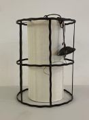 An Arts and Crafts style wrought metal lantern four branch light fitting of cylindrical form, H53cm