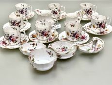 A Royal Crown Derby Posies 24 part tea service including 8 tea cups, 8 saucers, tea strainer, tea