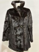 A lady's dark mink 3/4 length jacket, circa 1960/70, with cowl style collar, (length shoulder to hip