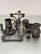 A gilt metal tripod cake stand base, collection of pewter including chamber candlestick, tankards,