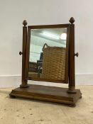 A large 19th century mahogany framed swing mirror of country house proportions, the rectangular