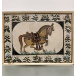 A Mogul style Indian painting of a ceremonial horse, watercolour on fabric enclosed within a foliate