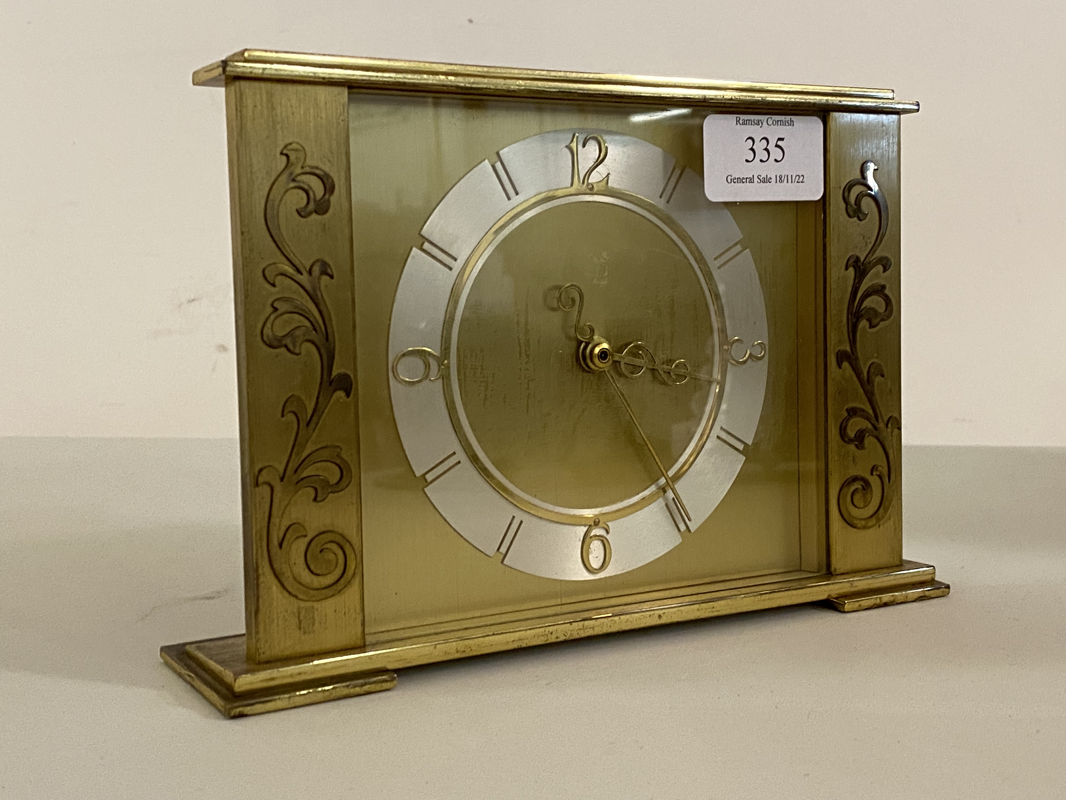 A mid 20th century brass mantel clock with quartz movement, H14cm