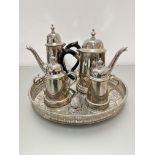 An Epns circular galleried tea tray with engraved decoration, (h 3cm x d 31cm) and a 4-piece Epns