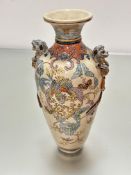 A Japanese pottery vase decorated with handpainted phoenix design with lion mask handles to sides,