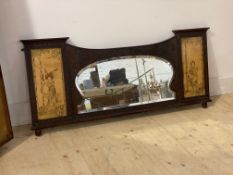 An early 20th century carved mahogany over mantel mirror, with bevelled plate flanked by two
