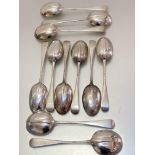 A set of six London silver rat tail pattern table spoons and a matching set of five soup spoons,