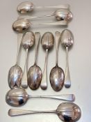 A set of six London silver rat tail pattern table spoons and a matching set of five soup spoons,