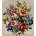 A Victorian wool work three-dimensional panel, with stylised violets, peony roses etc, worked with