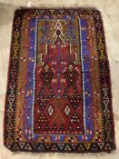 An old flat weave kilim prayer rug, of all over geometric design centred by a mihrab, 111cm x 170cm