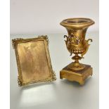 A 19thc ormolu and enamelled two-handled urn with beaded border and s scroll handles to side, (h