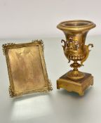 A 19thc ormolu and enamelled two-handled urn with beaded border and s scroll handles to side, (h
