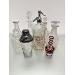 A pair of hobnail cut decanters, a/f, one with odd stopper, a crystal slice cut sherry decanter, a