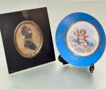 A 19thc Sevres porcelain saucer with cherub figure of Autumn, enclosed within gilt and turquoise