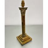 A well cast brass corinthian column oil lamp base converted to table lamp on fluted column and