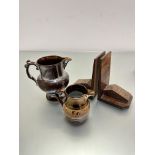 A pair of 1930s style walnut veneer bookends, a 19th century copper lustre jug with beaded and