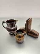 A pair of 1930s style walnut veneer bookends, a 19th century copper lustre jug with beaded and